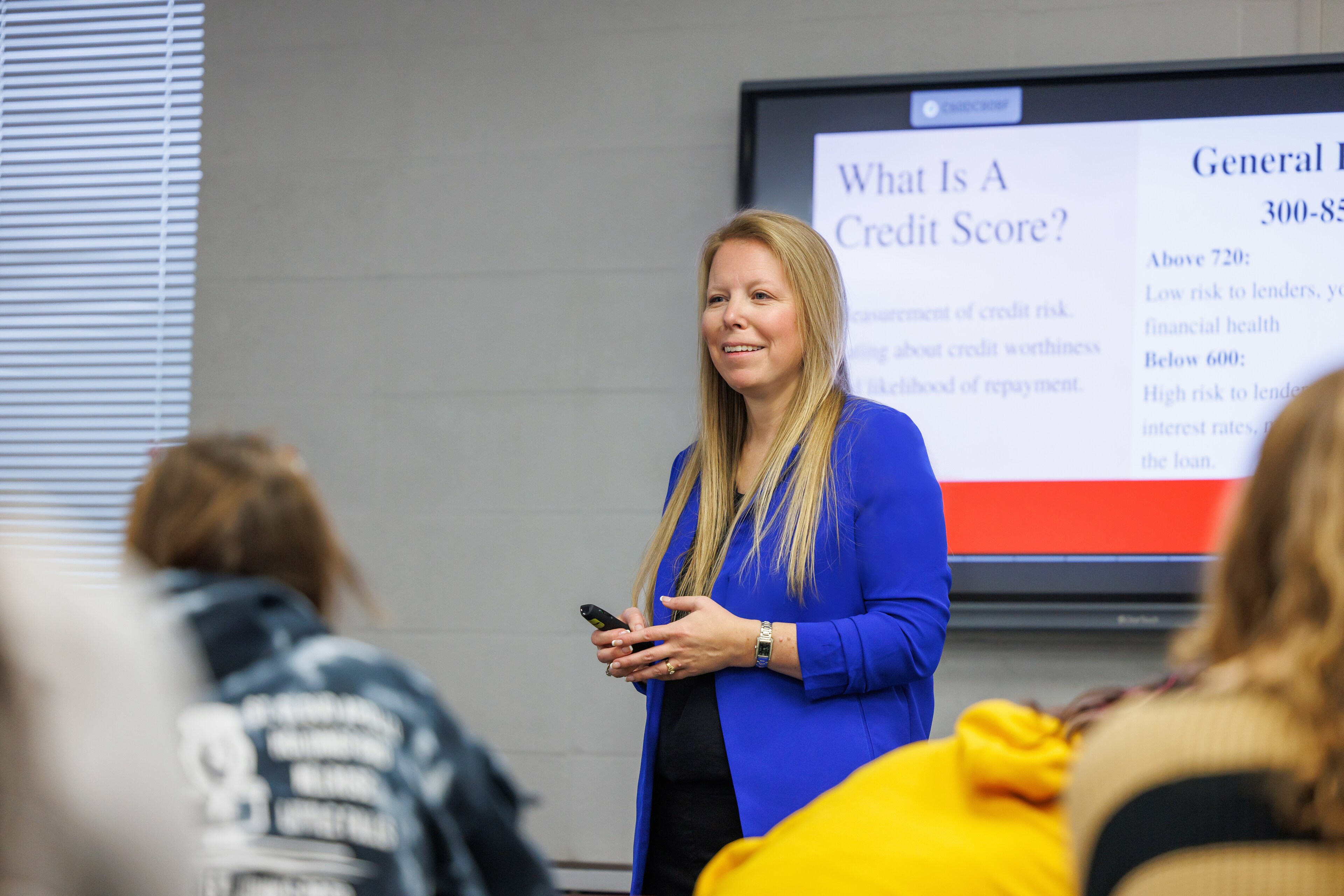Community Outreach Manager Nicole Pfeffer teaches a class about credit score